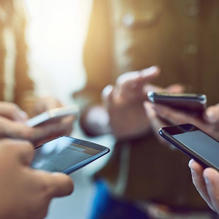 group looking at phones