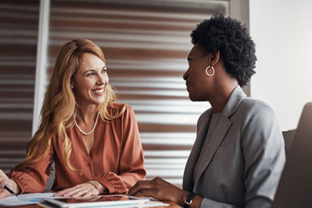 two women conversing