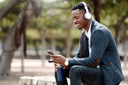 man wearing headphones on phone