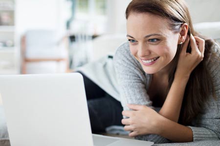 woman looking at laptop